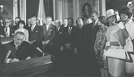President Lyndon B. Johnson signs the Voting Rights Act of 1965 into law. (Yoichi R. Okamoto)