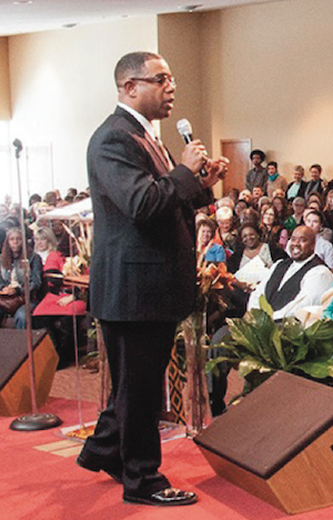 Rev. Gee addresses the crowd at a recent Town Hall meeting